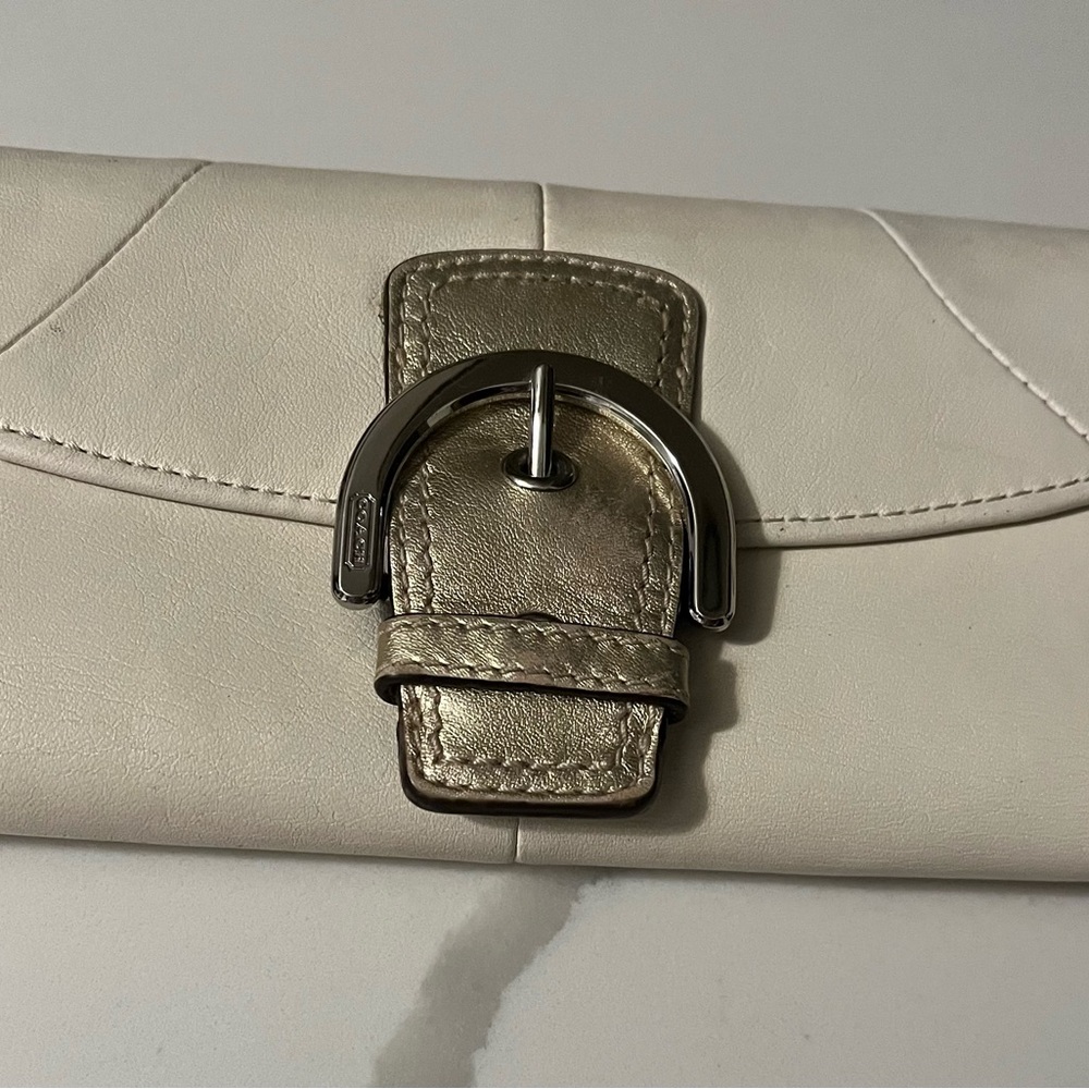 Elegant Coach Cream Clutch with Silver Accents